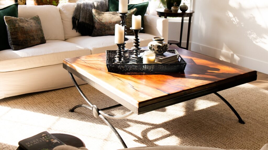 black candle holder on brown wooden table